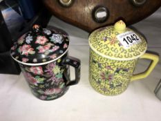 2 oriental style lidded mugs