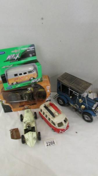A boxed Indian Chief motor cycle, a boxed VW camper van, another VW camper van,