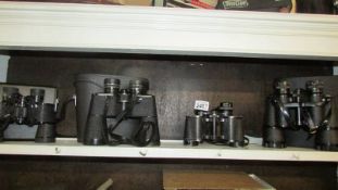 3 cased pairs of binoculars and one pair without case including Zenith, Sunderland etc.