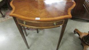 A reproduction mahogany hall table with serpentine front and drawer, 84 cm wide, 42.