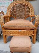 A good cane conservatory chair with stool.