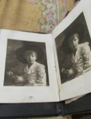 An interesting portfolio of approximately 9 signed prints of a boy with hat.