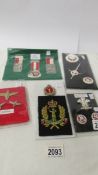 A quantity of badges and medals including Swiss shooting medals, Royal Regiment of Wales badges,