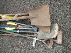 A quantity of assorted garden tools.
