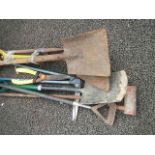 A quantity of assorted garden tools.