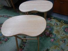A pair of oval pine fold up tables.