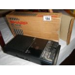 A Sharp R620E portable cassette player in original box.