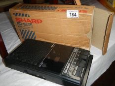 A Sharp R620E portable cassette player in original box.