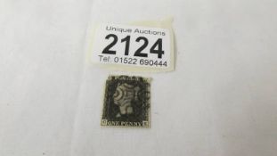 A Victorian penny black postage stamp.