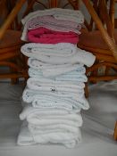 A quantity of white and other towels.