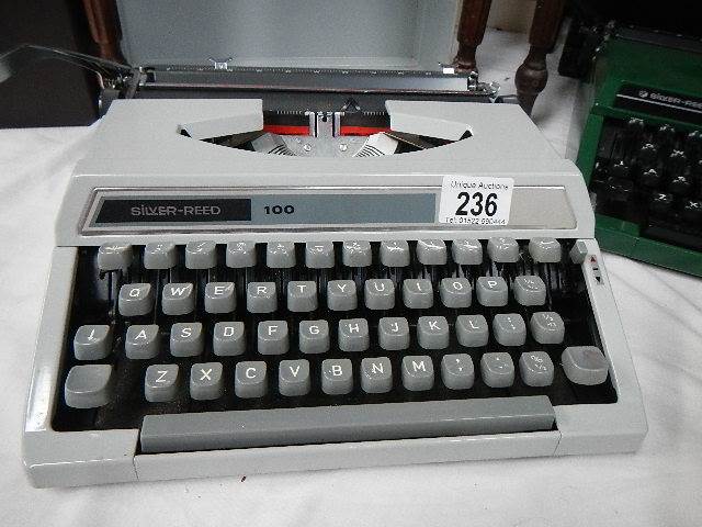 A Silver Reed 100 portable typewriter in grey.