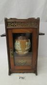 A good smoker's cabinet complete with a Royal Doulton tobacco jar.