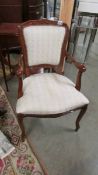 A mahogany framed cabriole leg arm chair.