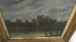 A gilt framed 19th century oil on canvas boating lake scene.