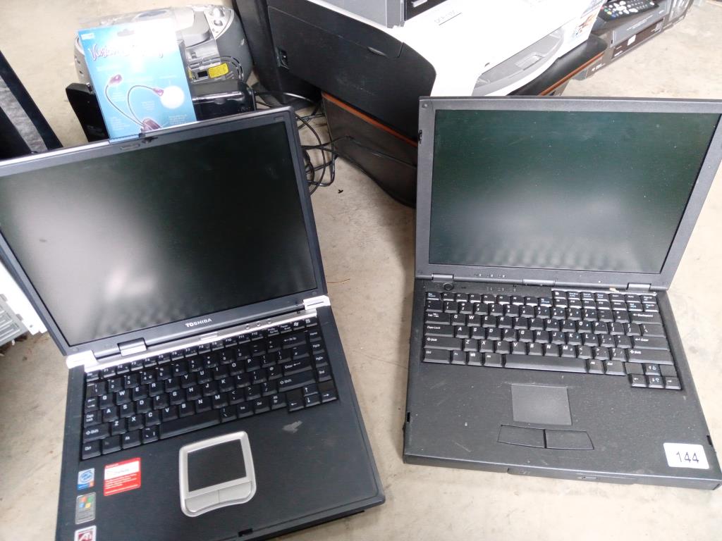 A Systemax and Toshiba laptop (both power up)