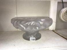 A large glass bowl marked Lalique France