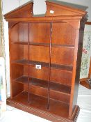 A set of mahogany collector's shelves.