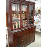 A mahogany veneered cabinet with glazed top.