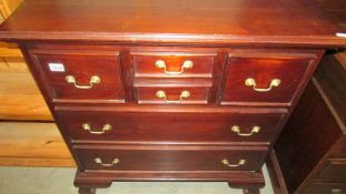 A mahogany chest of drawers.