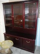 A mahogany 3 drawer glazed cabinet.