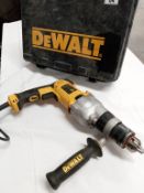 A Dewalt D21570 hammer drill with case.