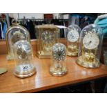 Six assorted clocks including anniversary.