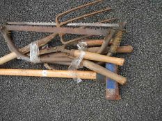 A quantity of assorted garden tools.