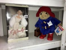 A boxed Mattel Marilyn Monroe collectors doll and a Paddington Bear