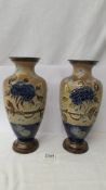 A pair of Doulton Slater vases, 32 cm, (one has repair to base).