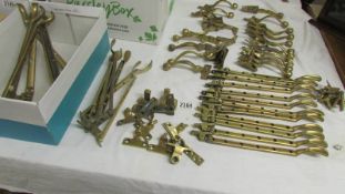 A good large lot of vintage (circa 1970's) solid brass window latches, catches, fasteners etc.