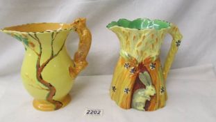 Two Burleigh pottery jugs - one with squirrel handle and the other decorated with a rabbit.