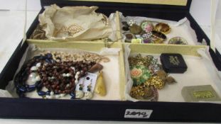 A jewellery box and a mixed lot of costume jewellery including earrings, brooches,