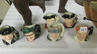 Six Royal Doulton character jugs - Don Quixote, Dick turpin, Lobster man, Gaoler,