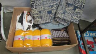 A box of various fabric items including curtains (approx. 170 cm drop), knitting wool etc.