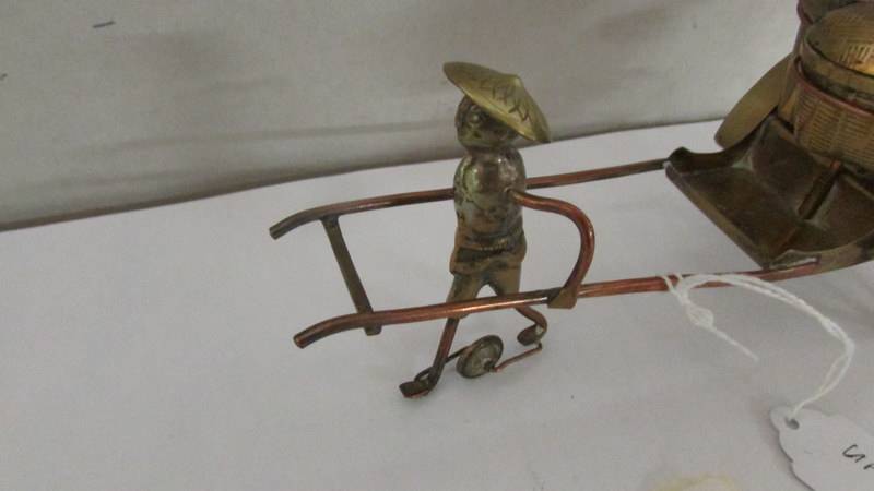 A nickel plated condiment set in the form of a rickshaw pulled by a Chinese man. - Image 2 of 3