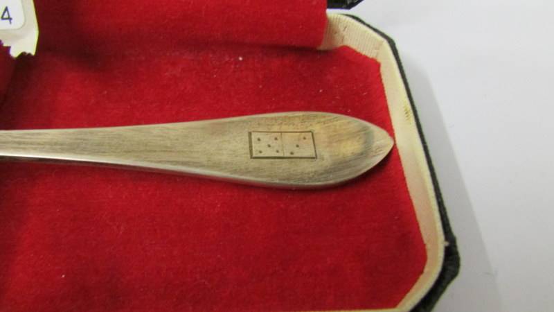 A cased silver spoon with engraving of domino. - Image 2 of 2