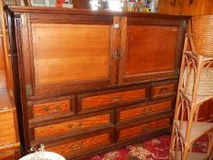 A Victorian 2 door cabinet on 7 drawer base.