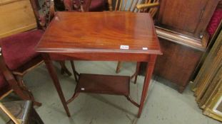 A mahogany inlaid occasional table.