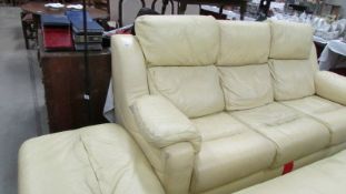 A G plan cream leather three seat sofa with matching stool/storage box.