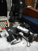 A quantity of camera's, binoculars etc.