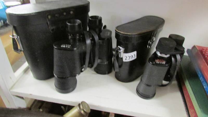 2 pairs of cased binoculars.