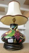 A Moorcroft table lamp with shade.