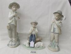 Three NAO figurines - 2 boys with sheep and a boy with bird.