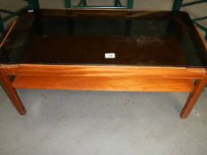 A glass topped coffee table.