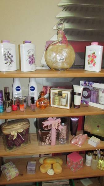 An assortment of toiletries in gift packs, soap, talc, nail varnish et.