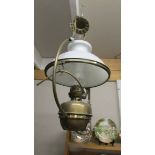 A Victorian brass hanging oil lamp with shade (converted to electric).