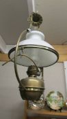 A Victorian brass hanging oil lamp with shade (converted to electric).