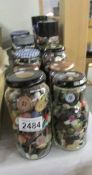 16 jars of assorted buttons.