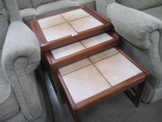 A nest of 3 tile topped tables