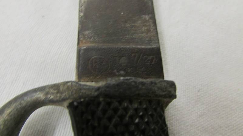 A WW2 German dagger with enamel insignia and stamped RZ M 7/27 1941 on blade. - Image 5 of 5